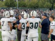 Skyview head coach Steve Kizer, second from left, talks to his defense during a timeout in the first half against Jesuit on Friday at Jesuit High School.