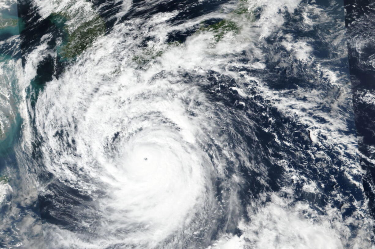 This Saturday, Sept. 17, 2022 satellite image released by NASA shows Typhoon Nanmadol, which is approaching southwest Japan.