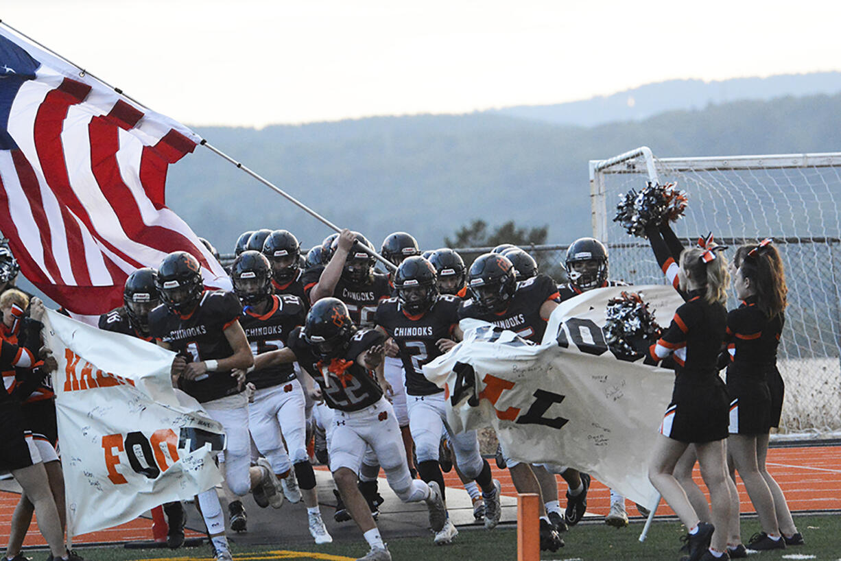 The Kalama Chinooks take the field prior to their non-league game against La Center on Thursday, Sept.