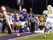 Washington's Michael Penix Jr. rushes to the Kent State 9-yard line during the second quarter of an NCAA college football game Saturday, Sept. 3, 2022, in Seattle.