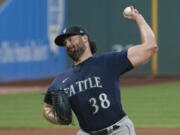 Seattle Mariners starting pitcher Robbie Ray delivers against the Cleveland Guardians during the first inning of a baseball game in Cleveland, Saturday, Sept. 3, 2022.