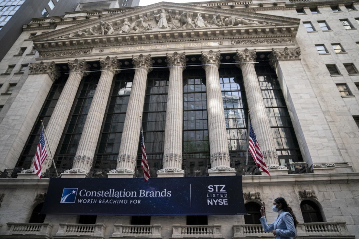 FILE - Pedestrians pass the New York Stock Exchange, Thursday, May 5, 2022, in the Manhattan borough of New York. Stocks are opening broadly lower on Wall Street and Treasury yields are rising ahead of a key decision on interest rates by the Federal Reserve. The S&P 500 index was off 1.2 percent in the early going Tuesday, Sept. 20, 2022.