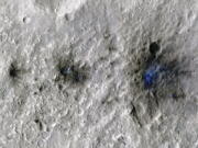 This undated photo released by NASA shows craters that were formed by a Sept. 5, 2021, meteoroid impact on Mars, the first to be detected by NASA's InSight. Taken by NASA's Mars Reconnaissance Orbiter, this enhanced-color image highlights the dust and soil disturbed by the impact in blue in order to make details more visible to the human eye. NASA lander on Mars has captured the vibrations and sounds of four meteorites striking the planet's surface. Scientists reported Monday, Sept. 19, 2022, that Mars InSight detected seismic and acoustic waves from a series of impacts in 2020 and 2021.