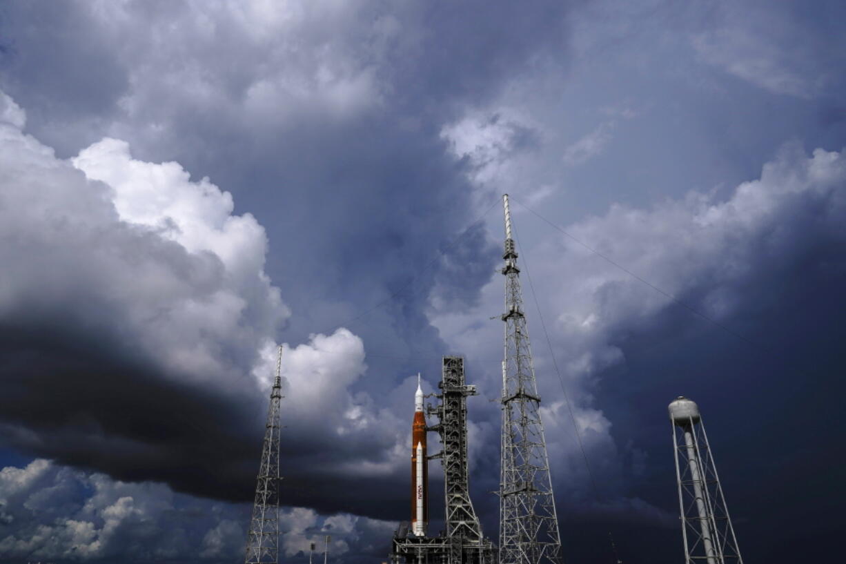 FILE - The NASA moon rocket stands on Pad 39B before a launch attempt for the Artemis 1 mission to orbit the moon at the Kennedy Space Center on Sept. 2, 2022, in Cape Canaveral, Fla. NASA mission managers decided Monday, Sept. 26, 2022, to move its moon rocket off the launch pad and into shelter due to Hurricane Ian's uncertain path.