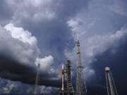 FILE - The NASA moon rocket stands on Pad 39B before a launch attempt for the Artemis 1 mission to orbit the moon at the Kennedy Space Center on Sept. 2, 2022, in Cape Canaveral, Fla. NASA mission managers decided Monday, Sept. 26, 2022, to move its moon rocket off the launch pad and into shelter due to Hurricane Ian's uncertain path.