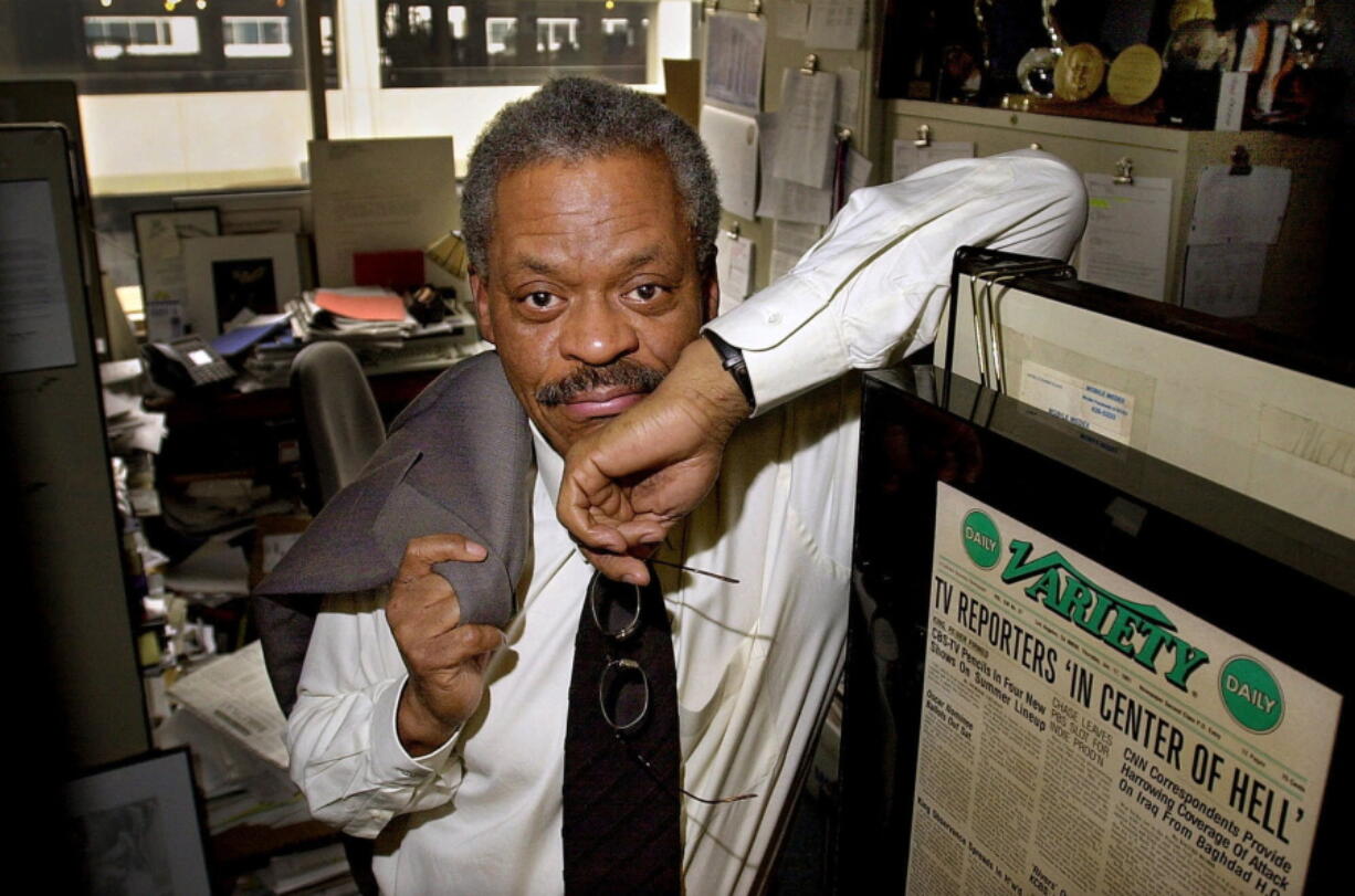 FILE - CNN anchor Bernard Shaw poses in his office at CNN's Washington bureau on Feb. 15, 2001. Shaw, who was CNN's original chief anchor when the network started in 1980, died of pneumonia in Washington on Wednesday, Sept. 7, 2022, according to Tom Johnson, the network's former chief executive. Shaw was 82.