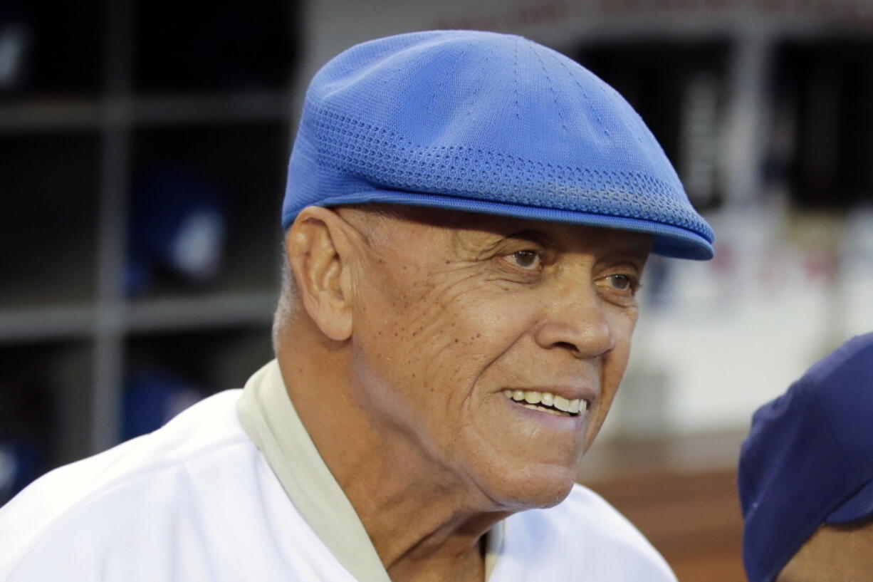 Former Los Angeles Dodgers shortstop Maury Wills in 2014. Wills, who helped the Los Angeles Dodgers win three World Series titles with his base-stealing prowess, has died. The team says Wills died Monday night, Sept. 19, 2022, in Sedona, Ariz. He was 89. (AP Photo/Jae C.