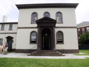 Visitors stand in 2009 outside the Touro Synagogue, in Newport, R.I., the oldest existing Jewish house of worship in the United States. (Eric J.