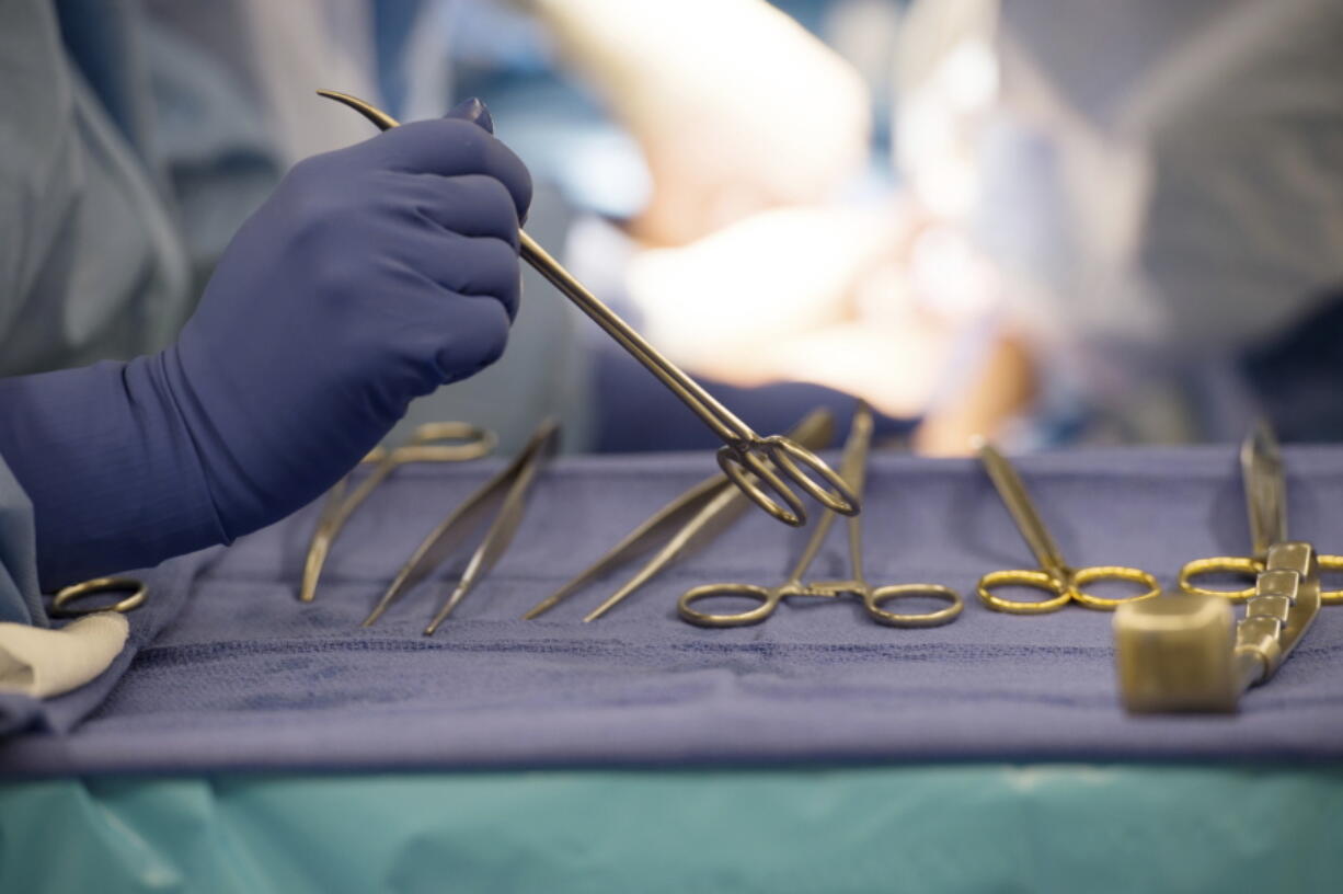 FILE - Surgical instruments are used during an organ transplant surgery at a hospital in Washington on Tuesday, June 28, 2016. The U.S. counted its millionth organ transplant on Friday, Sept. 9, 2022, a milestone that comes at a critical time for Americans still desperately waiting for that chance at survival.