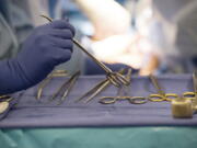 FILE - Surgical instruments are used during an organ transplant surgery at a hospital in Washington on Tuesday, June 28, 2016. The U.S. counted its millionth organ transplant on Friday, Sept. 9, 2022, a milestone that comes at a critical time for Americans still desperately waiting for that chance at survival.