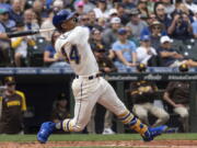 Seattle Mariners' Julio Rodriguez hits a single off San Diego Padres starting pitcher Mike Clevinger during the second inning of a baseball game, Wednesday, Sept. 14, 2022, in Seattle.