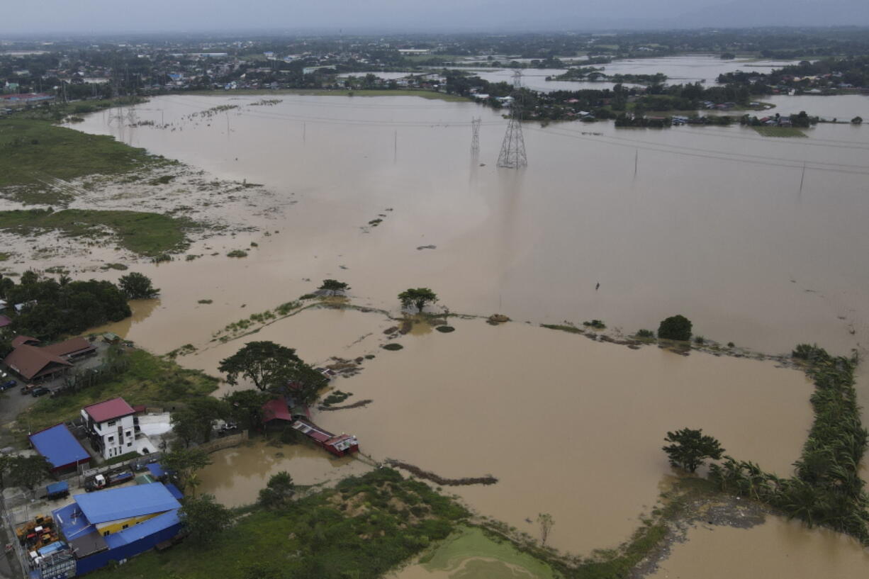 Flooded area due to Typhoon Noru in San Miguel town, Bulacan province, Philippines, Monday, Sept. 26, 2022. Typhoon Noru blew out of the northern Philippines on Monday, leaving some people dead, causing floods and power outages and forcing officials to suspend classes and government work in the capital and outlying provinces.