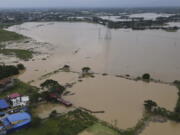 Flooded area due to Typhoon Noru in San Miguel town, Bulacan province, Philippines, Monday, Sept. 26, 2022. Typhoon Noru blew out of the northern Philippines on Monday, leaving some people dead, causing floods and power outages and forcing officials to suspend classes and government work in the capital and outlying provinces.