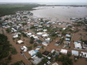 Homes are flooded on Salinas Beach after the passing of Hurricane Fiona in Salinas, Puerto Rico, Monday, Sept. 19, 2022.