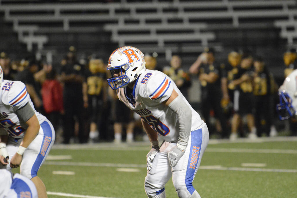 Ridgefield linebacker Wyatt Bartroff awaits the snap in the fourth quarter of a 2A Greater St. Helens League football game at Kiggins Bowl on Thursday, Sept. 22, 2022.