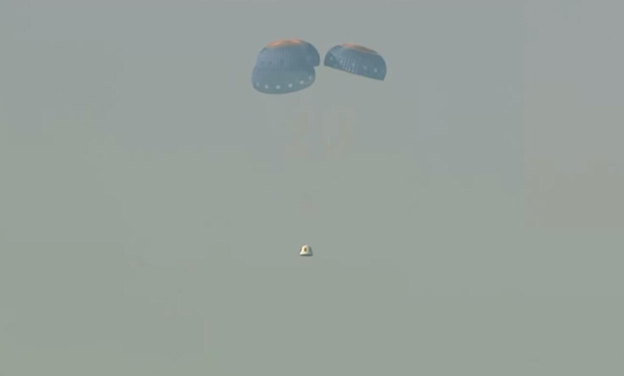 This image provided by Blue Origin shows a capsule containing science experiments after a launch failure, parachuting onto the desert floor on Monday, Sept. 12, 2022. Jeff Bezos' rocket company has suffered its first launch failure. No one was aboard, only science experiments. The Blue Origin rocket veered off course over West Texas about 1 1/2 minutes after liftoff Monday.