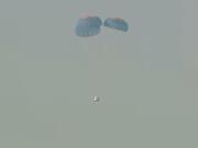 This image provided by Blue Origin shows a capsule containing science experiments after a launch failure, parachuting onto the desert floor on Monday, Sept. 12, 2022. Jeff Bezos' rocket company has suffered its first launch failure. No one was aboard, only science experiments. The Blue Origin rocket veered off course over West Texas about 1 1/2 minutes after liftoff Monday.