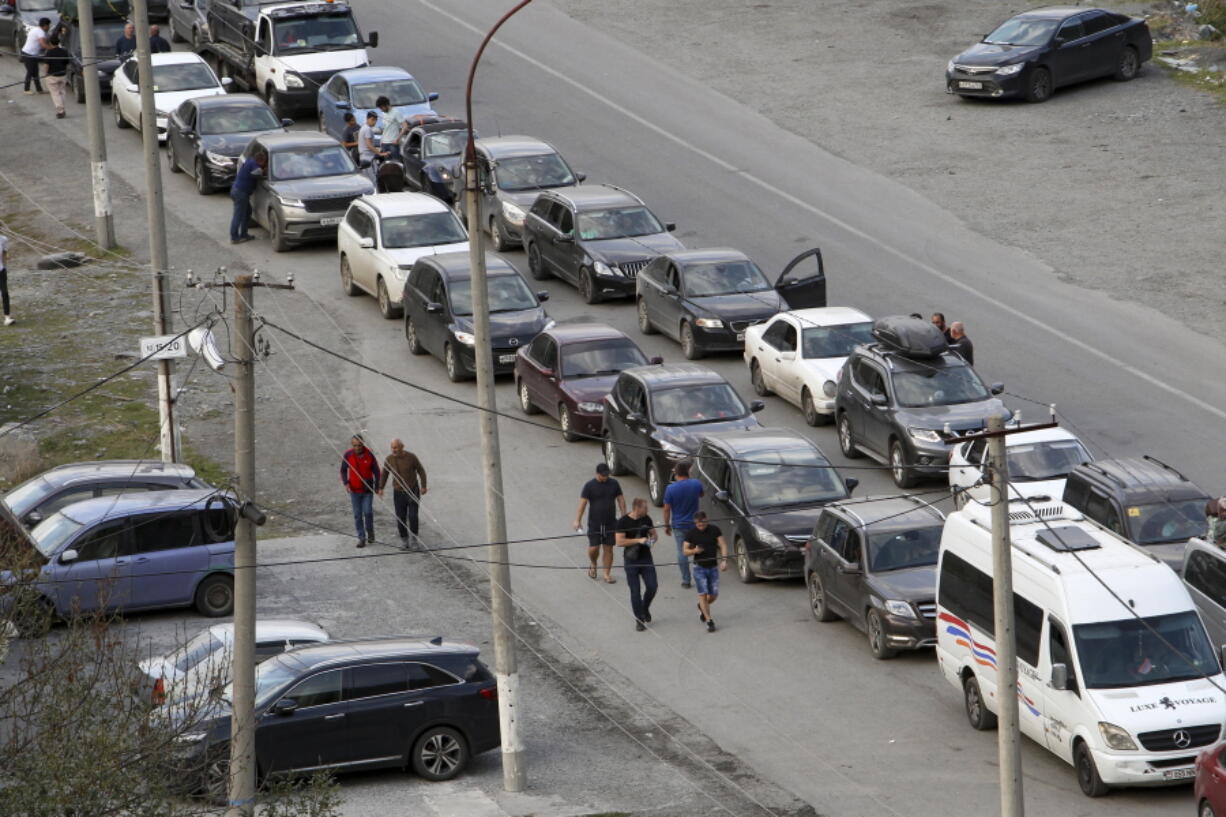 Cars queuing toward the border crossing at Verkhny Lars between Russia and Georgia, leaving Chmi, North Ossetia - Alania Republic, in Russia, Thursday, Sept. 29, 2022. Long lines of vehicles have formed at a border crossing between Russia's North Ossetia region and Georgia after Moscow announced a partial military mobilization to bolster its troops in Ukraine, many Russians are leaving their homes.