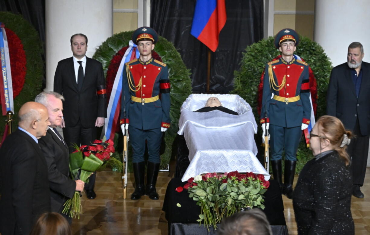 U.S. Ambassador to Russia John Joseph Sullivan, second from left, walks to the coffin of former Soviet President Mikhail Gorbachev inside the Pillar Hall of the House of the Unions during a farewell ceremony Saturday in Moscow. Gorbachev died Tuesday.