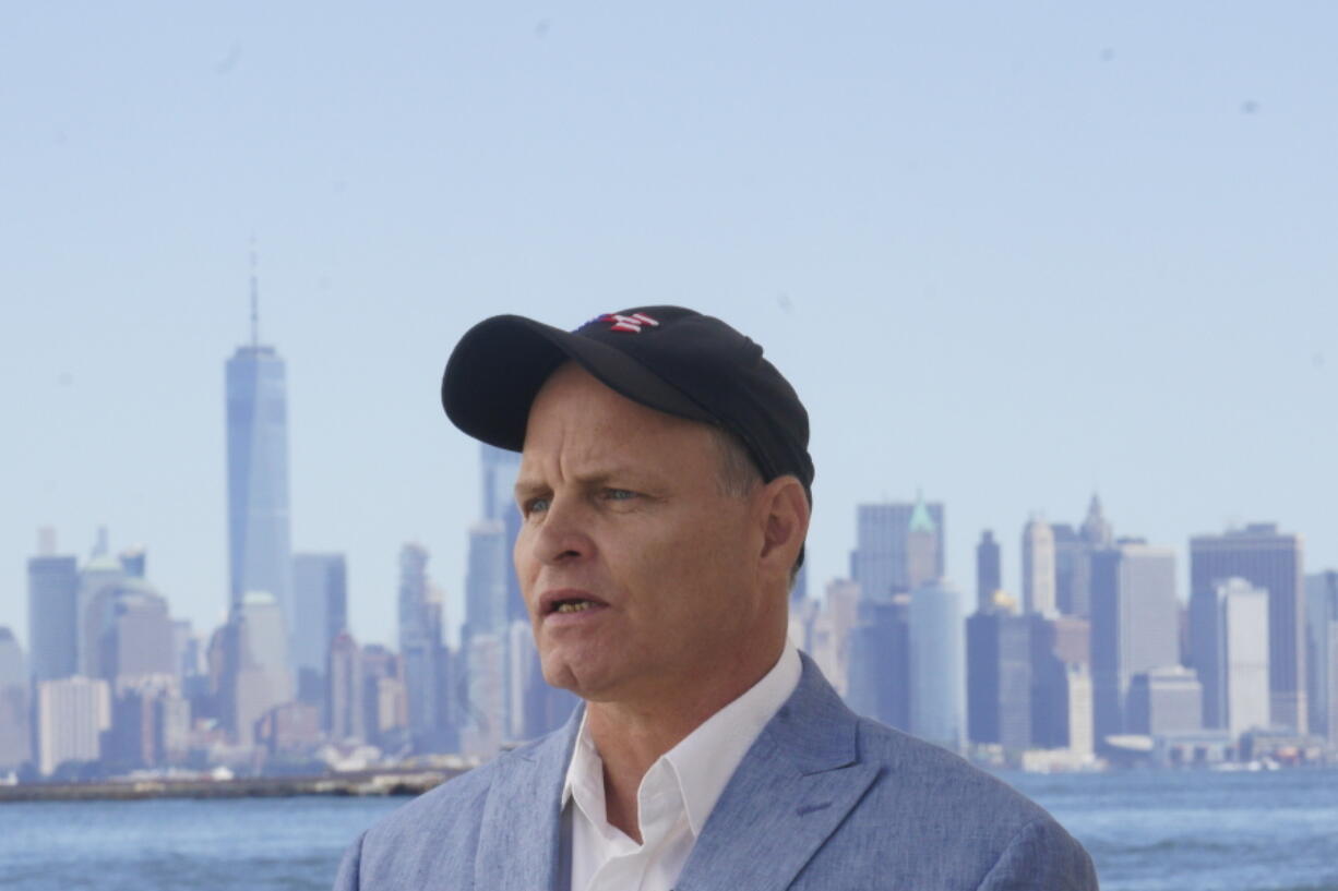 Eddie Bracken listens during an interview at the Staten Island September 11th Memorial, in view of lower Manhattan, Friday Sept. 2, 2022, in New York. Bracken, a carpenter whose sister Lucy Fishman was killed in the Sept. 11 attacks on the World Trade Center, is awaiting the trial of the attack's self-professed architect Khalid Sheik Mohammed and his co-defendants at Guantanamo.