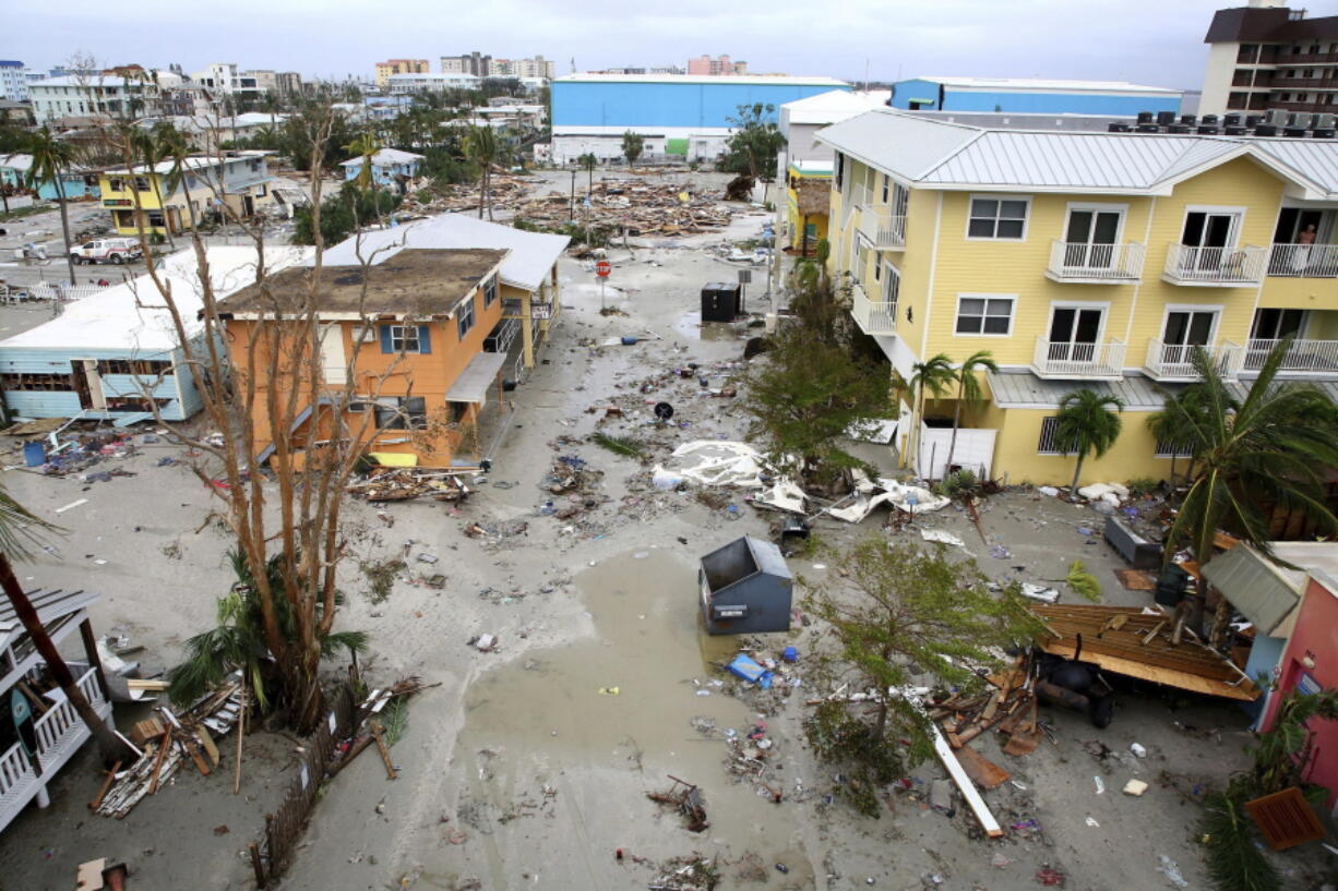 Damaged homes and businesses are seen in Fort Myers Beach, Fla., on Thursday, Sep 29, 2022, following Hurricane Ian. (Douglas R.