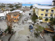 Damaged homes and businesses are seen in Fort Myers Beach, Fla., on Thursday, Sep 29, 2022, following Hurricane Ian. (Douglas R.