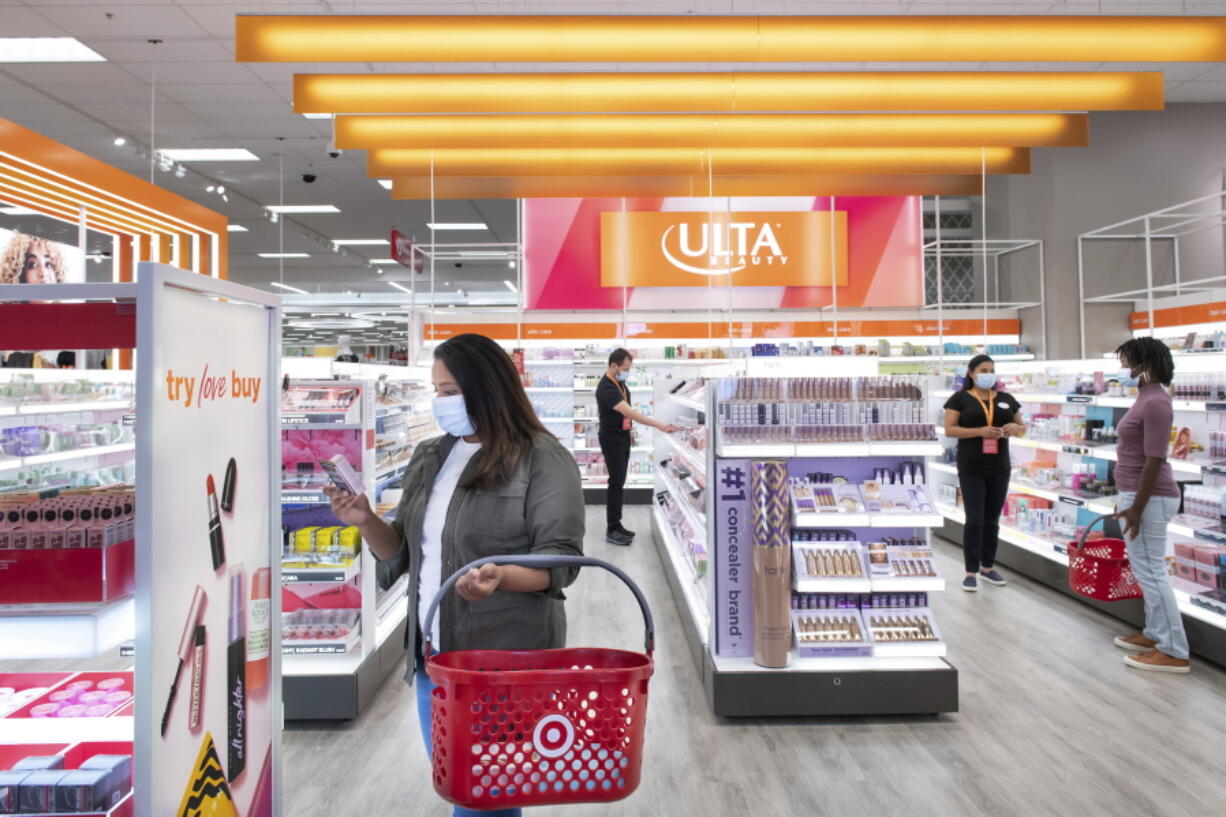 This photo provided by Target shows the Ultra Beauty inside Target department store in Edina, Minn., on Aug. 14, 2021.  Americans are splurging on beauty as they tighten their budgets elsewhere. According to market research company IRI, sales of eye, face and lip makeup has gone up across stores. It comes as major retailers slashed their financial outlooks for the year after seeing shoppers pull back on many discretionary items in the latest quarter.