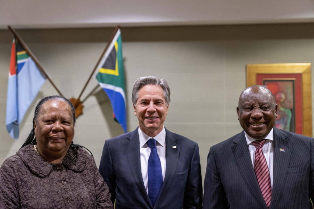 From left; South Africa's Foreign Minister Naledi Pandor, U.S. Secretary of State Antony Blinken and South Africa's President Cyril Ramaphosa pose for photographs as they meet at Waterkloof Air Force Base in Centurion, South Africa, Tuesday, Aug. 9, 2022. Blinken is on a ten day trip to Cambodia, Philippines, South Africa, Congo, and Rwanda.