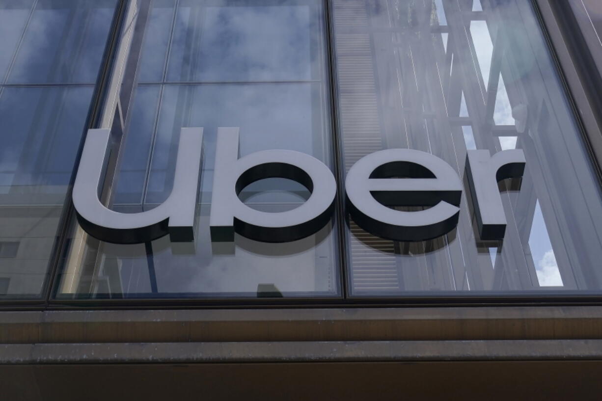 FILE - An Uber sign is displayed at the company's headquarters in San Francisco, Monday, Sept. 12, 2022. Uber said Thursday, Sept. 15, that it reached out to law enforcement after a hacker apparently breached its network. A security engineer said the intruder provided evidence of obtaining access to crucial systems at the ride-hailing service.