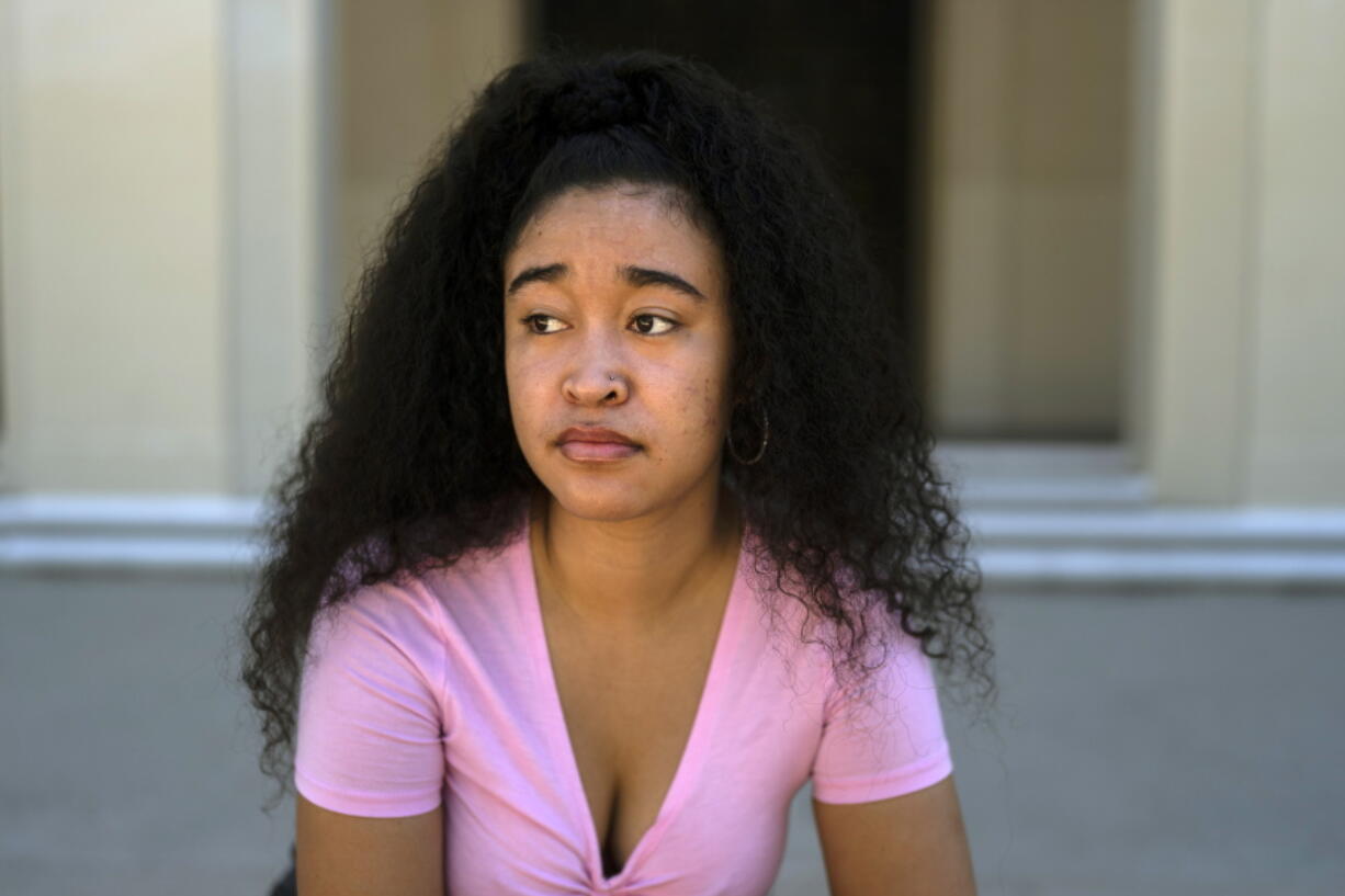 Marina Aina, a 21-year-old student majoring in American Studies at Pomona College, poses for photos on the school's campus in Claremont, Calif., Thursday, Sept. 22, 2022. Aina was used to getting paid for her internships and could not see taking an unpaid opportunity over a summer job. "If I felt that it wasn't compensated then I wouldn't go for it because I wouldn't have the funds to cover it," Aina says. "I wouldn't want to ask my parents, who are helping me pay for college, to pay for something I'm doing over the summer." (AP Photo/Jae C.