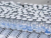 This August 2022 photo provided by Pfizer shows vials of the company's updated COVID-19 vaccine during production in Kalamazoo, Mich.