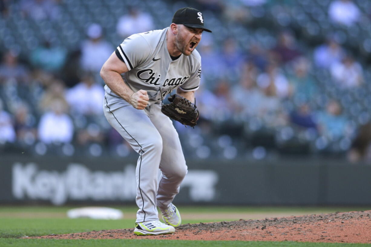 Chicago White Sox closing pitcher Liam Hendriks reacts after striking out Seattle Mariners' Adam Frazier to end the baseball game Wednesday, Sept. 7, 2022, in Seattle. The White Sox won 9-6.