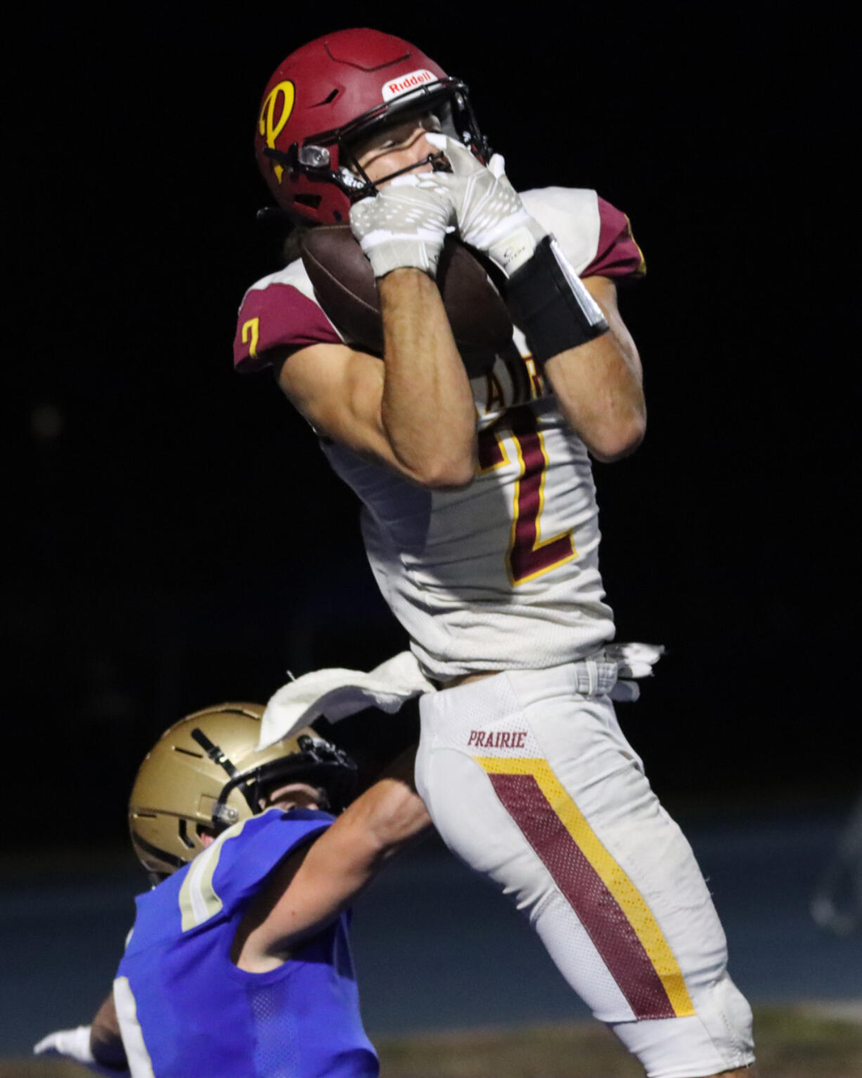 Prairie’s Alex Juhl (2) pulls in a touchdown pass against Kelso’s Connor Noah during Kelso’s 28-20 win in Kelso on Friday, Sept. 30, 2022.