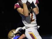 Prairie’s Alex Juhl (2) pulls in a touchdown pass against Kelso’s Connor Noah during Kelso’s 28-20 win in Kelso on Friday, Sept. 30, 2022.