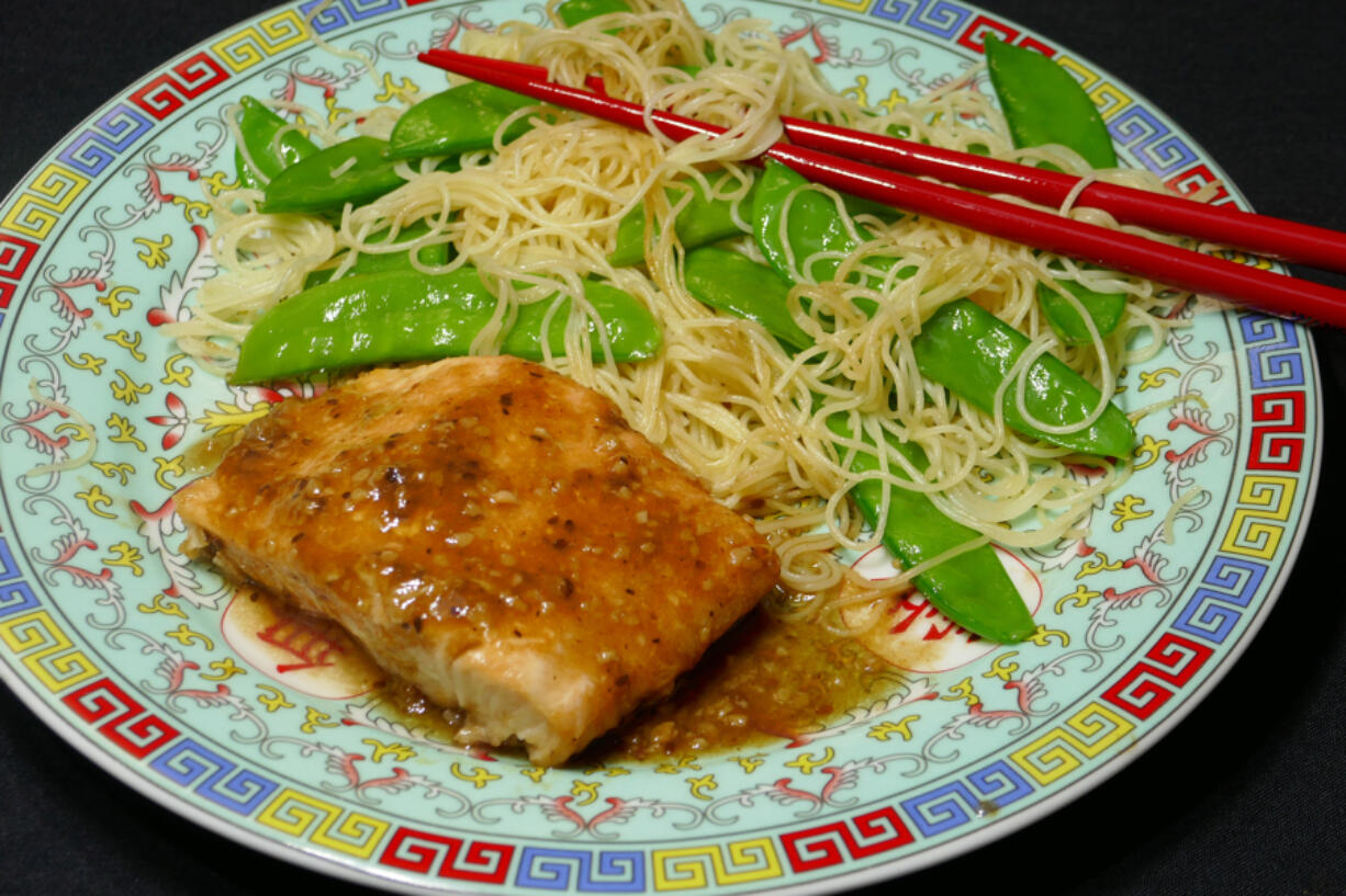 Teriyaki salmon with pasta and snow peas.