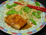 Teriyaki salmon with pasta and snow peas.