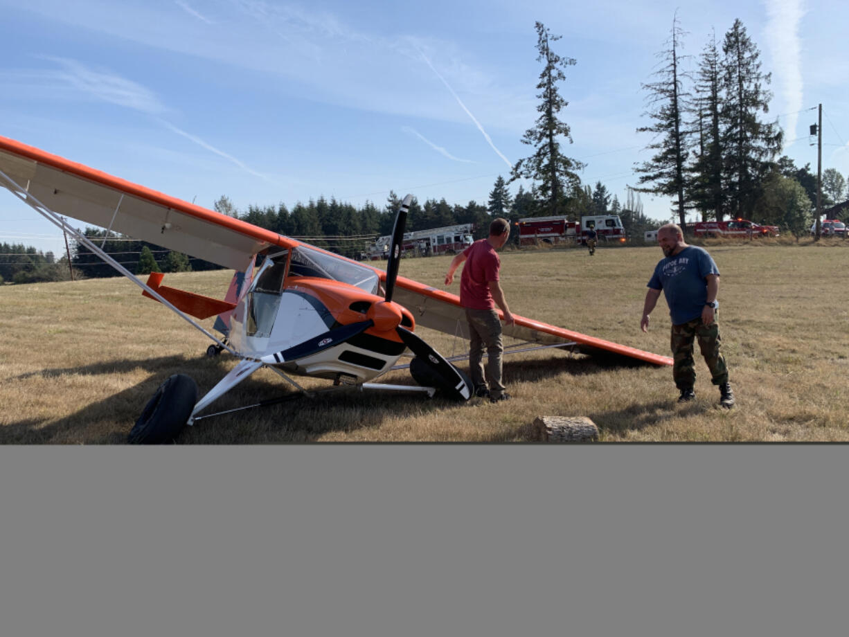 The pilot of a small, Cessna-type plane walked away uninjured after making an emergency landing Thursday afternoon in a field in Ridgefield.