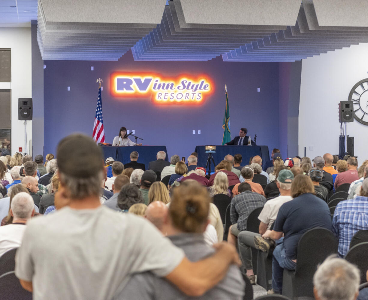 Taylor Balkom/The Columbian 
 A crowd listens to congressional candidates Marie Gluesenkamp Perez and Joe Kent speak at a Sept. 27 debate. We fact-checked it afterward.