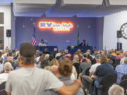 Taylor Balkom/The Columbian 
 A crowd listens to congressional candidates Marie Gluesenkamp Perez and Joe Kent speak at a Sept. 27 debate. We fact-checked it afterward.