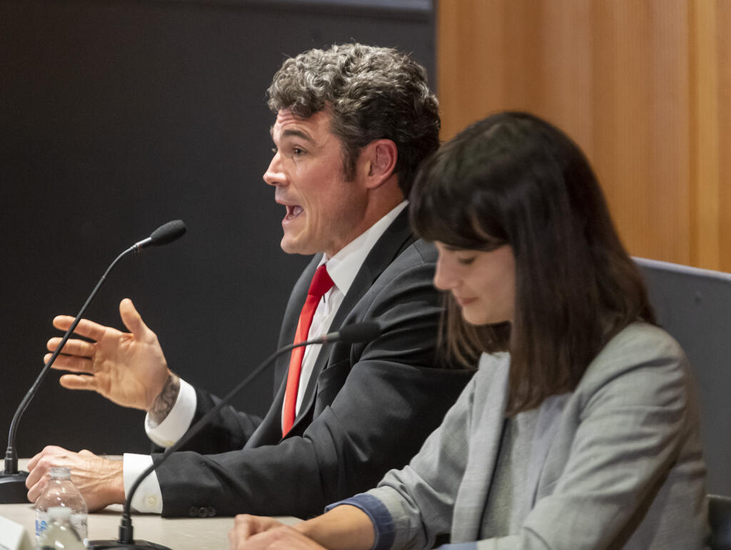 Republican candidate for Washington’s 3rd Congressional District Joe Kent, left, answers a question on Saturday, Oct. 15, 2022, during a debate at the Vancouver Community Library.