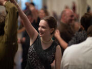 Camas High School student Audrey Wagner, 16, dances with friends to the music of the Ne Plus Ultra Jass Orchestra at Providence Academy.