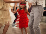 Five-year-old flapper girl Sana Teo dances with her parents, Hiro and Alan.