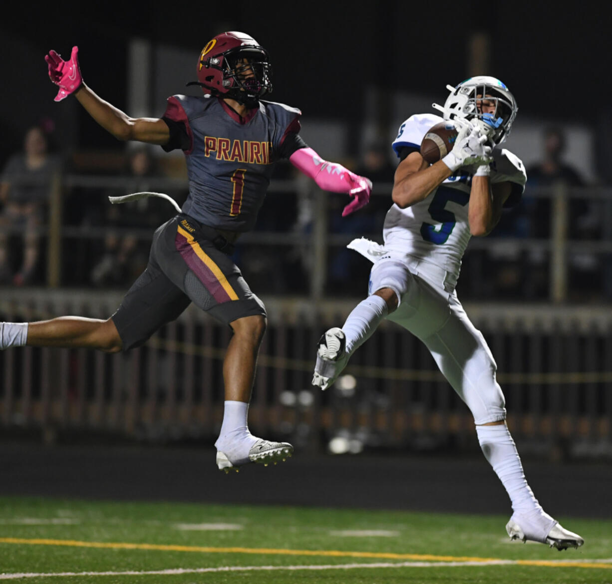 Mountain View senior Jacob Martin, right, catches a long touchdown Friday, Oct. 7, 2022, during a game between Prairie and Mountain View at District Stadium in Battle Ground.