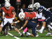 Camas senior Taylor Ioane, center stretches the football over the goal line for a touchdown Friday, Oct. 14, 2022, during the Papermakers??? 36-33 win against Skyview at Kiggins Bowl.