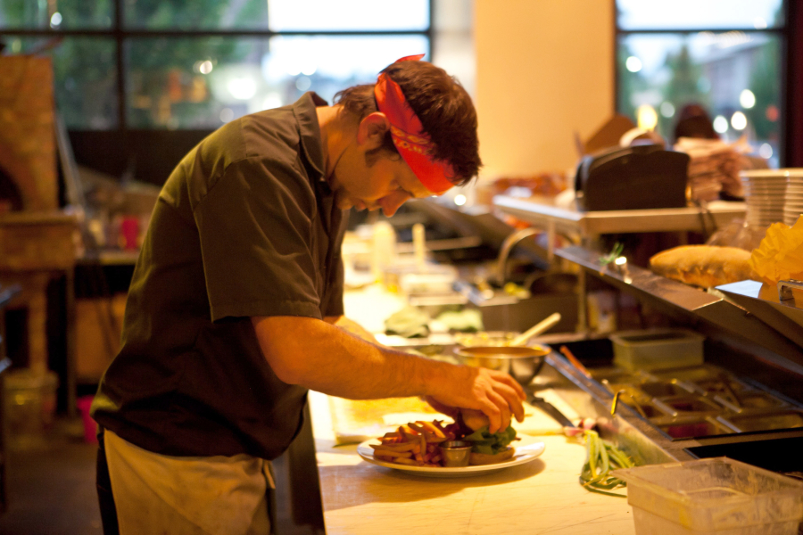 Vancouver chef David Mork prepares a plate. In 2008, he co-opened Lapellah in Vancouver. The restaurant  helped elevate Vancouver's fine-dining scene.