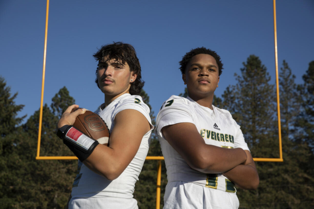 Evergreen quarterbacks Jayden Crace, left, and Khalil Osbin pause for a portrait during football practice at Evergreen High School on Tuesday, October 12, 2022.