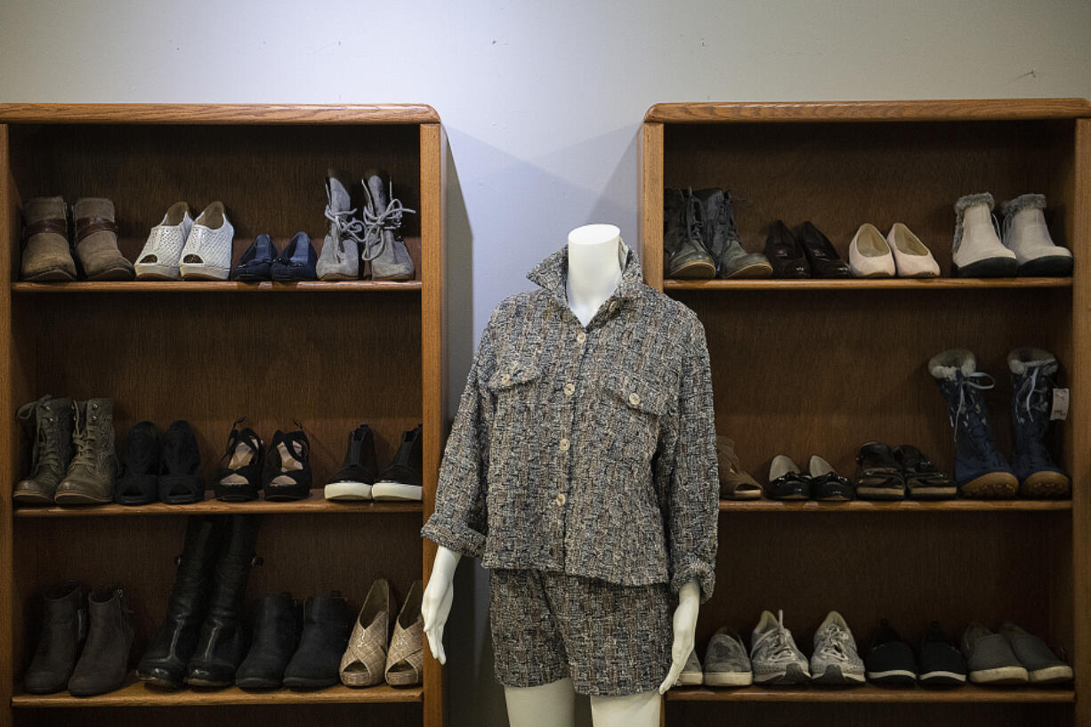 A selection of shoes and fashions on display at b.divine resale clothing boutique in downtown Vancouver. High-end designer items are priced accordingly, though bargains can be found.