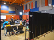 Portable walls form a classroom Tuesday in an auxiliary gym in Ridgefield. Ridgefield School District schools are converting extracurricular spaces into classrooms to alleviate crowding.