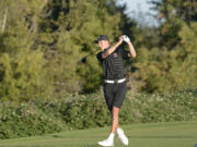 Camas' Eli Huntington tees off on No. 18 at Heron Lakes Golf Course in Portland during the 4A district tournament on Tuesday, Oct. 11, 2022.