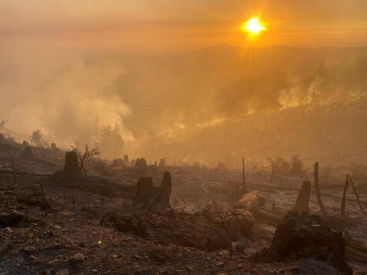 The sun sets over the Nakia Creek Fire.